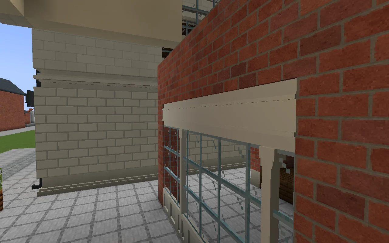 After repair: recessed ivory rails close the signboard to the brickwork above and flush glazing below from the same camera position.