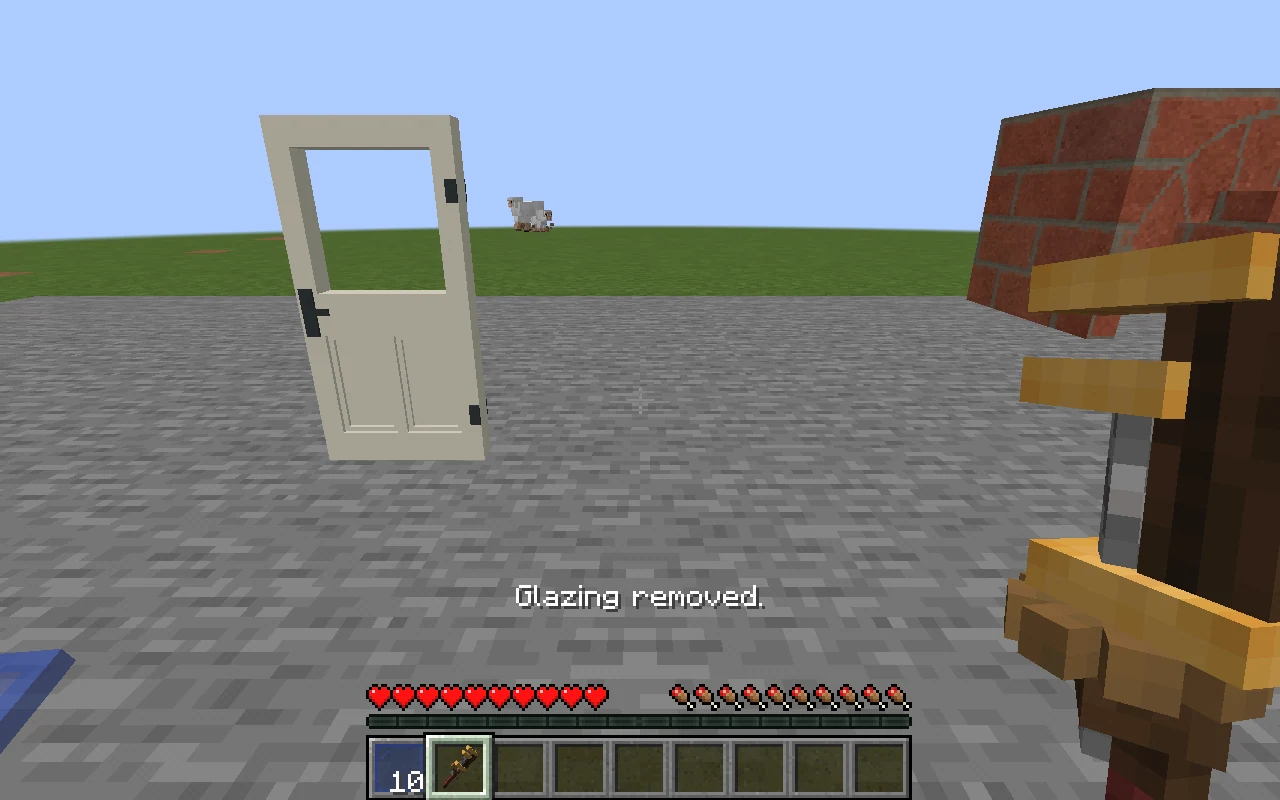 The second player holds the Create wrench beside the now-empty door; the inventory shows ten blue panes.