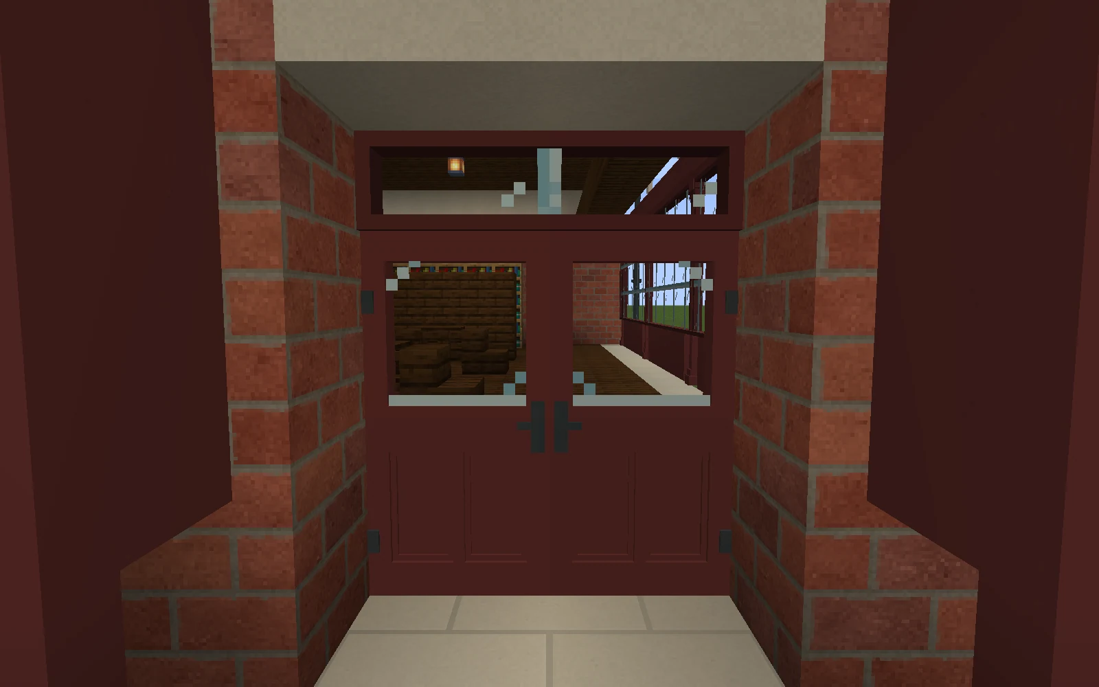 Paired oxblood glazed shop doors meet under a fanlight between brick returns.