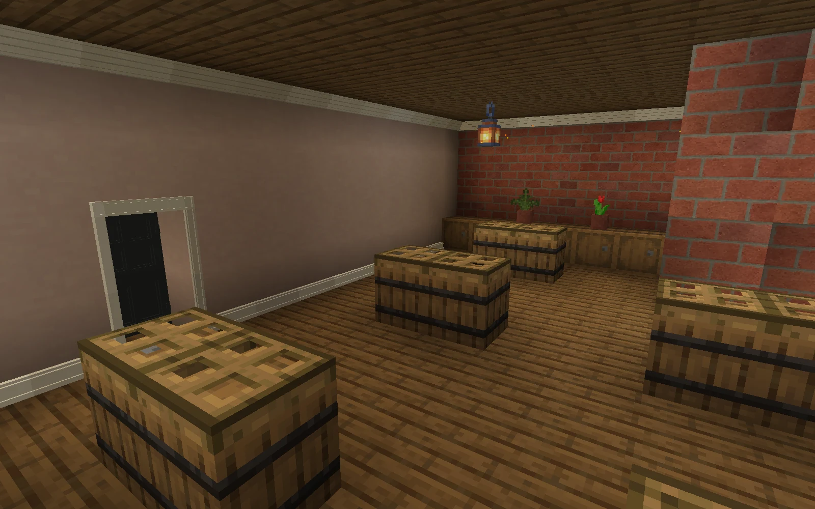 A timber-floored brick shop has barrel counters, an ivory door casing, fitted skirting and a pale cornice below its dark ceiling.
